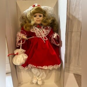 Vintage Christmas animated sitting porcelain doll 90s